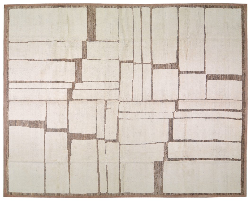 Rectangular rug with a geometric pattern of squares in beige and brown tones. Stone simulating